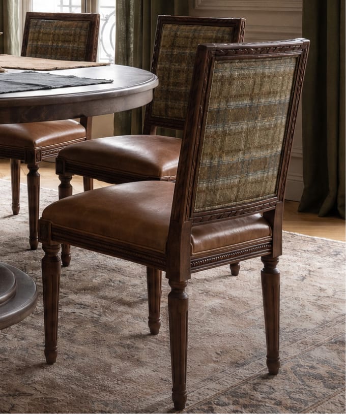 Woven dining chairs surrounding a round table